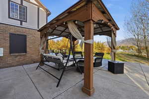 View of patio / terrace with a gazebo, outdoor lounge area, and a mountain view