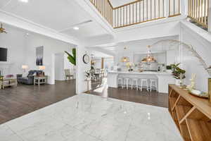 Foyer entrance featuring dark wood finished floors and recessed lighting