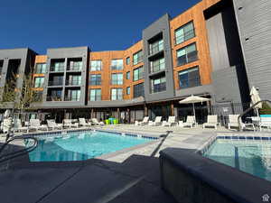 Community pool with a patio