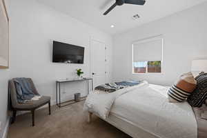 Bedroom with carpet, a ceiling fan, and recessed lighting