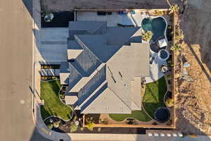 Aerial view of property and surrounding area featuring a pool