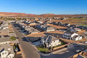 Aerial perspective of suburban area with a mountain backdrop