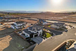 Aerial perspective of suburban area with a mountain backdrop