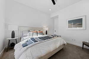 Bedroom featuring carpet flooring, ceiling fan, and recessed lighting
