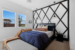 Carpeted bedroom with baseboards