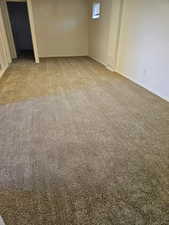Basement Bedroom featuring light colored carpet