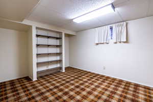 Tile ceiling with plaid carpet