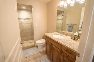 Bathroom with vanity and a stall shower