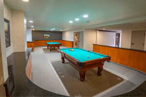 Game room featuring billiards, recessed lighting, a wainscoted wall, and wooden walls
