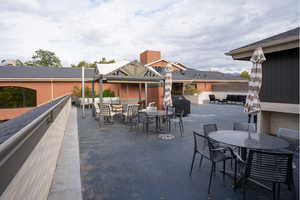 View of patio / terrace with outdoor dining space, grilling area, and outdoor lounge area