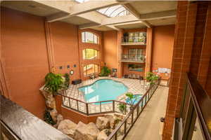 View of pool with a jacuzzi