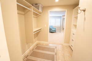 Spacious closet with light tile patterned floors