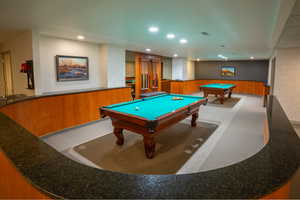 Rec room featuring wallpapered walls, billiards table, wainscoting, recessed lighting, and wooden walls