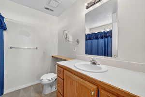 Full bath with a shower with shower curtain and vanity