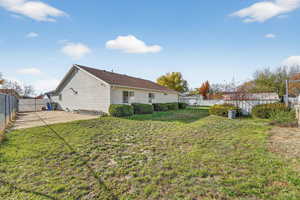 Back of house featuring a fenced backyard