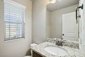 Bathroom with vanity and toilet