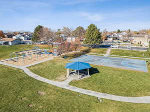 View of home's community featuring a lawn, a residential view, a patio area, and community basketball court