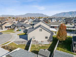 Aerial view of residential area featuring a mountainous background
