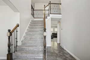 Stairway with arched walkways and a towering ceiling