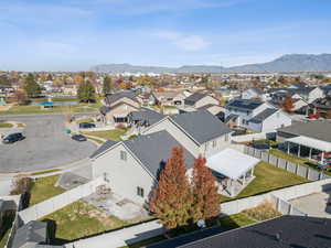 Aerial perspective of suburban area featuring a mountain backdrop