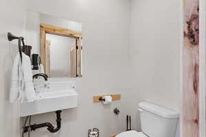 Half bathroom featuring toilet