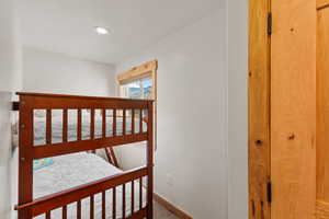 Bedroom with baseboards and recessed lighting