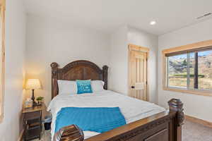 Bedroom featuring baseboards and recessed lighting