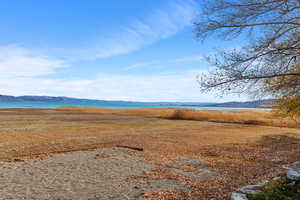 View of mountain backdrop featuring a large body of water