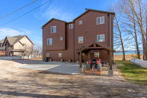 Back of property featuring faux log siding