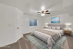 Bedroom featuring carpet and a ceiling fan