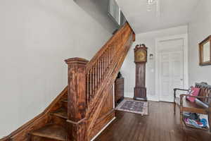 Stairs with hardwood / wood-style flooring