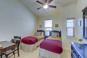 Bedroom with ceiling fan and baseboards