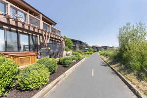 View of asphalt road with curbs