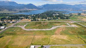 Expansive land parcel featuring open fields, existing roadways, and infrastructure elements