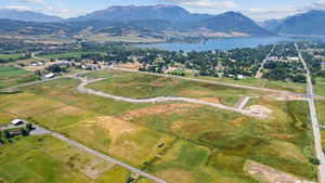 Expansive land parcel featuring open fields and partial road infrastructure