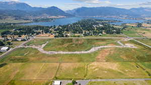 Aerial view of property's location featuring a water and mountain view