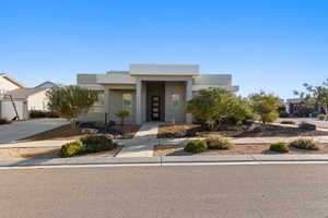 Contemporary home with stucco siding and driveway