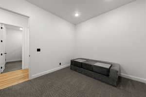 Unfurnished room with carpet and recessed lighting