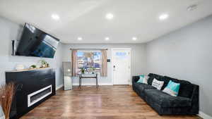 Living area featuring recessed lighting and wood finished floors