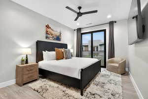 Bedroom with ceiling fan, light wood-style floors, and recessed lighting