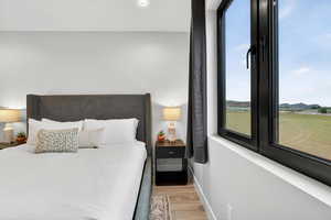 Bedroom featuring light wood-style floors and recessed lighting