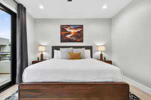 Bedroom featuring light wood finished floors, access to outside, recessed lighting, and a ceiling fan