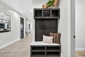 Mudroom with light wood-style floors and recessed lighting