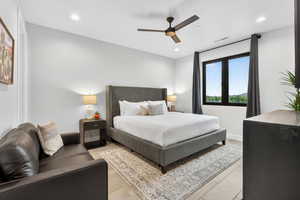 Bedroom featuring ceiling fan, recessed lighting, and light wood-type flooring