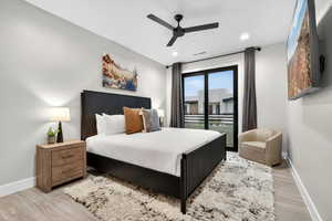 Bedroom featuring ceiling fan, light wood finished floors, recessed lighting, and access to exterior