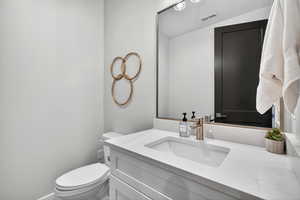 Bathroom with vanity and toilet