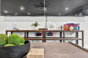 Sitting room with a ceiling fan and recessed lighting