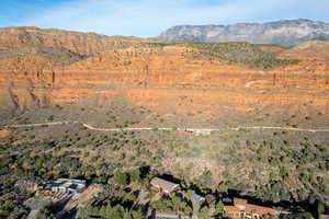 Aerial view of property's location with a mountainous background