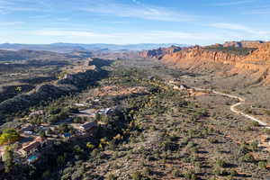 Aerial view of property and surrounding area with mountains