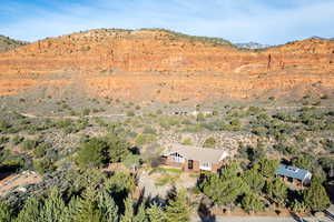 Aerial view of property's location with a mountain backdrop